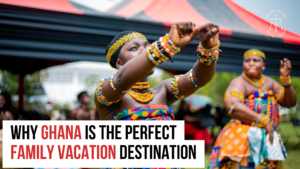 Two women in colorful traditional Ghanaian attire performing a cultural dance at an outdoor event, promoting Ghana as a vibrant family vacation destination.